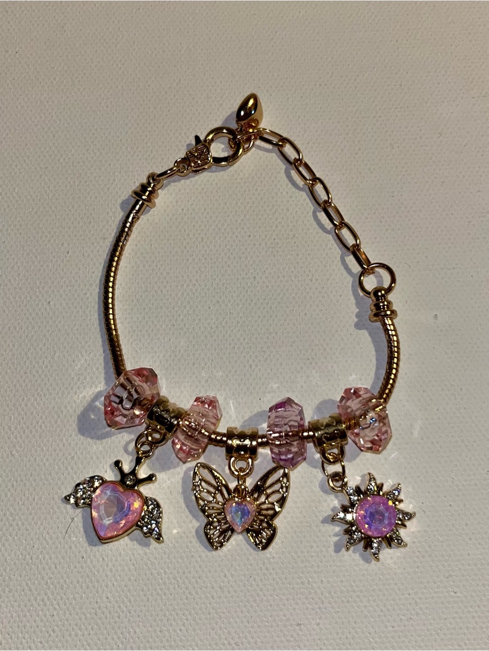 Gold-Tone Pink Crystal Charm Bracelet with Butterfly, Heart & Sun Charms